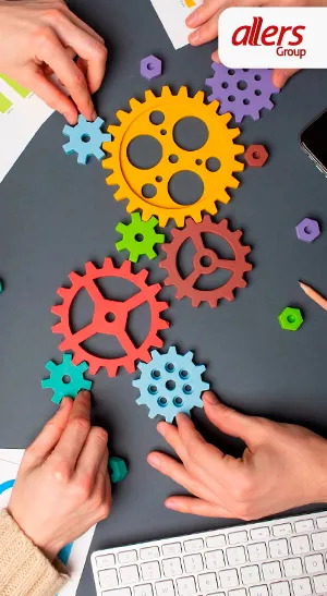 Trabajo en equipo y colaboración empresarial. Engranajes como símbolo de soluciones integrales en Allers Group.